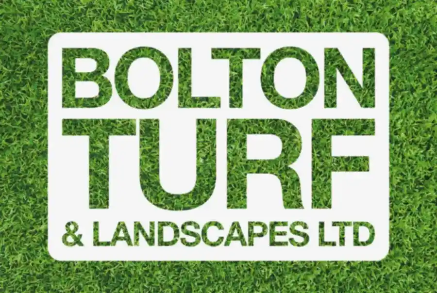 A green grass background with a white rectangular frame featuring the text "BOLTON TURF & LANDSCAPES LTD" in bold letters, inviting all your landscaping questions.